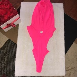 Hot pink body suit